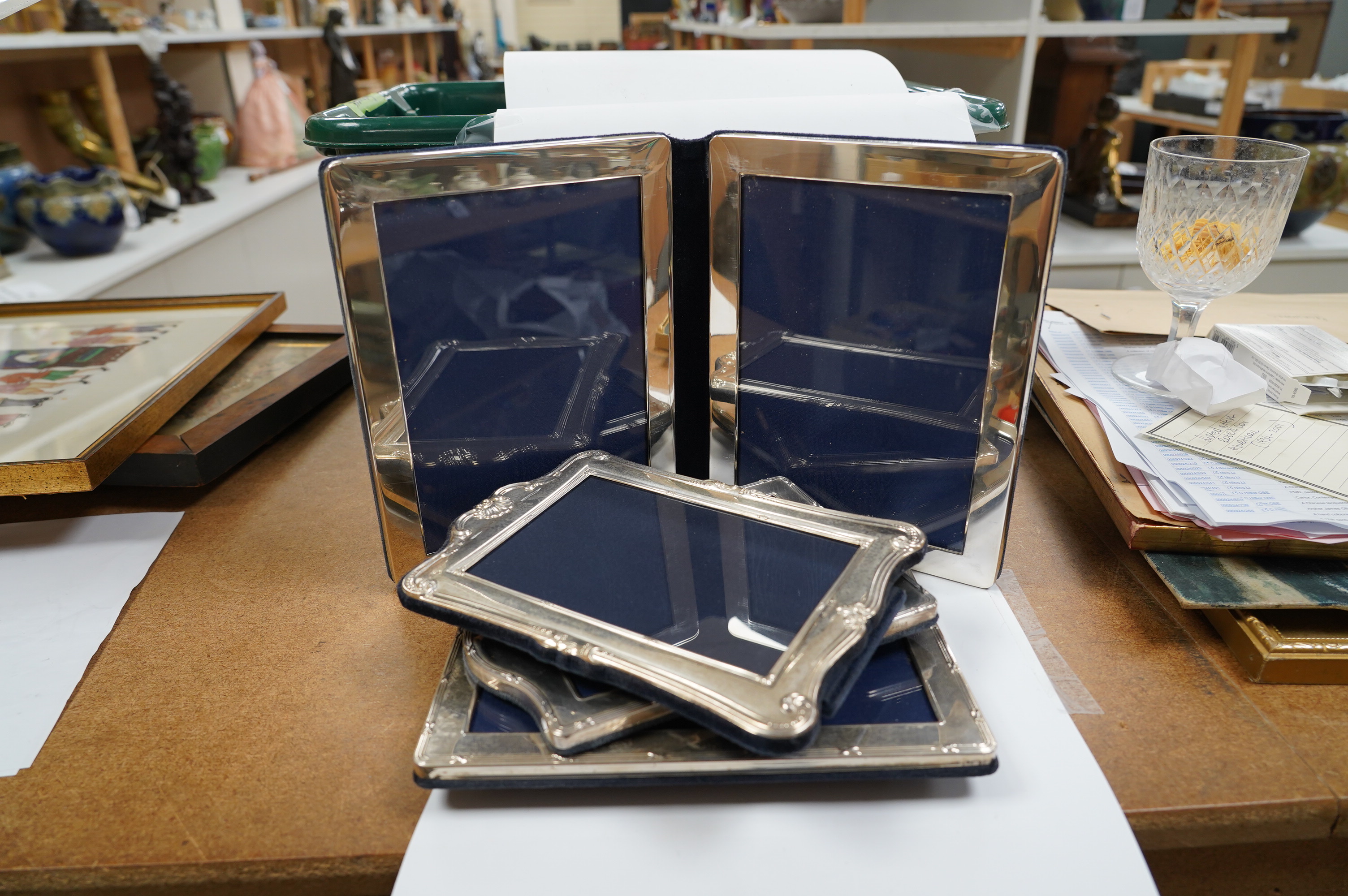 Four assorted silver mounted photograph frames including a double, largest 21.3cm. Condition - fair to good